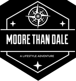 A black and white logo for moore than dale.