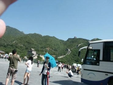 A group of people walking on the side of a road.