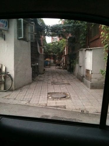 A street with many buildings and trees