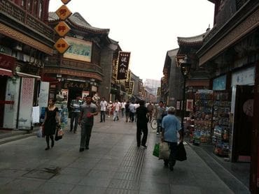 A group of people walking down the street.