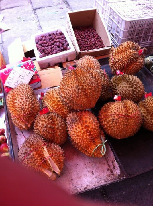 A pile of fruit sitting on top of a table.