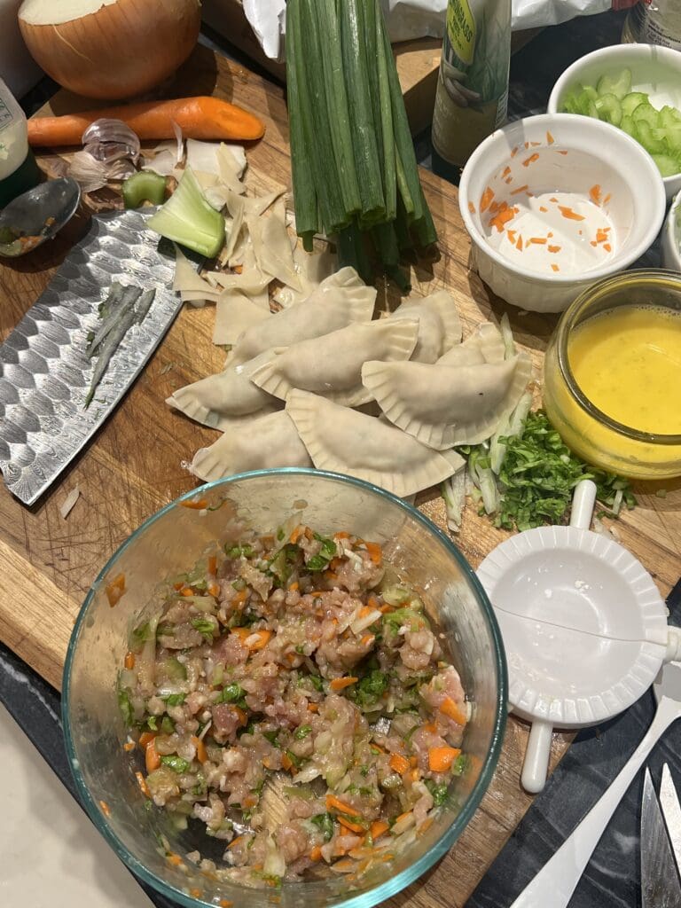 A table with pasta and vegetables on it