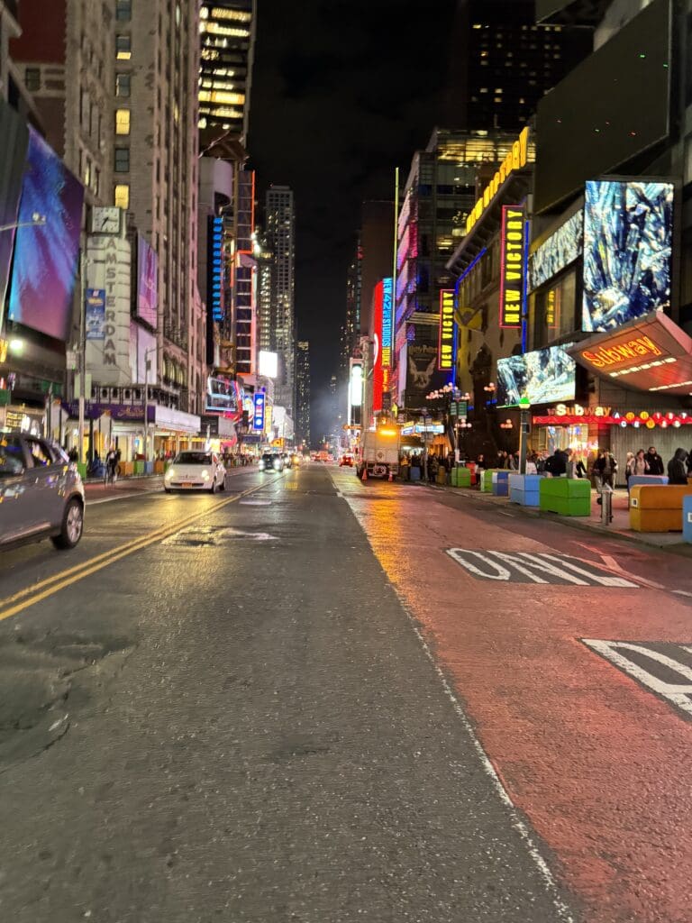 A street with cars parked on the side of it.