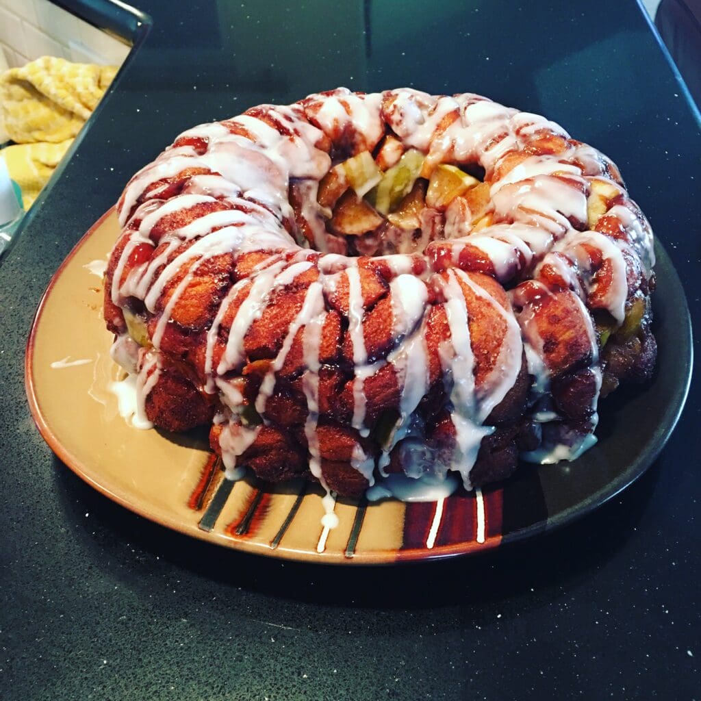 A bundt cake with white icing on top of it.