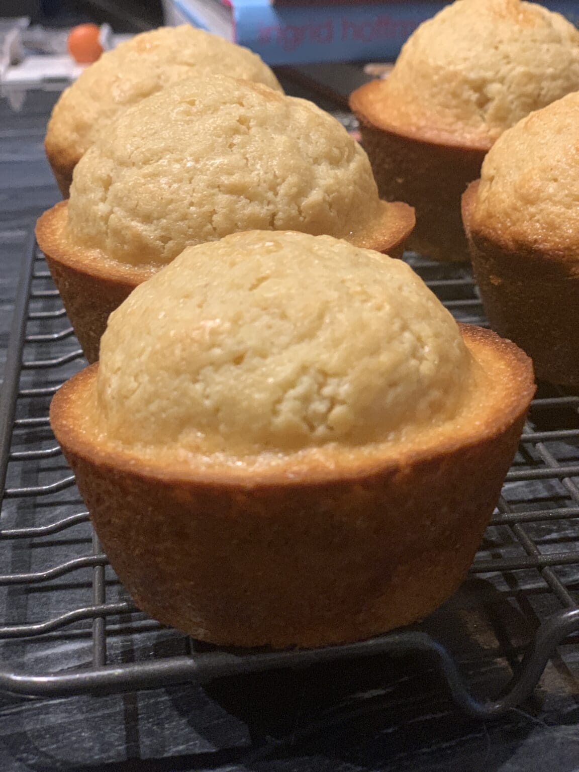 A close up of muffins on a cooling rack